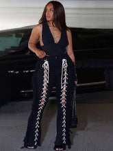 Pantalones largos con volantes, calados y anudados